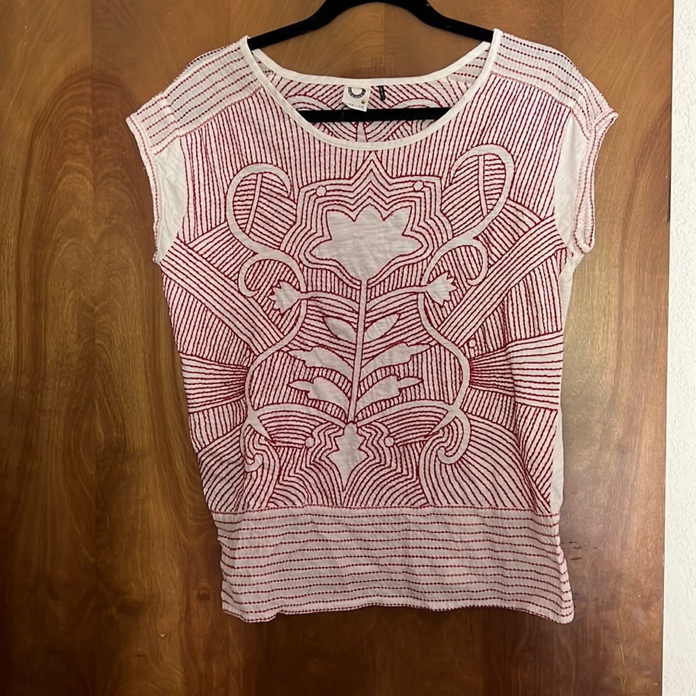 Anthropogenic embroidered top